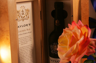 Taylor's Golden Age Port wine bottle with a rose . Luxury Gift