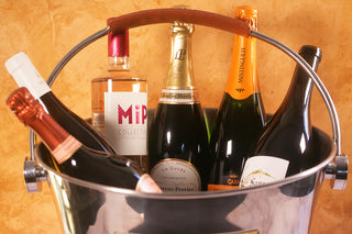 Metal ice bucket with champagne bottles