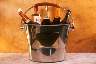 Silver champagne bucket with bottles inside. Champagnegift