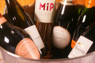 Assorted wine bottles in a metal bucket Laurent Perrier . Champagnegift